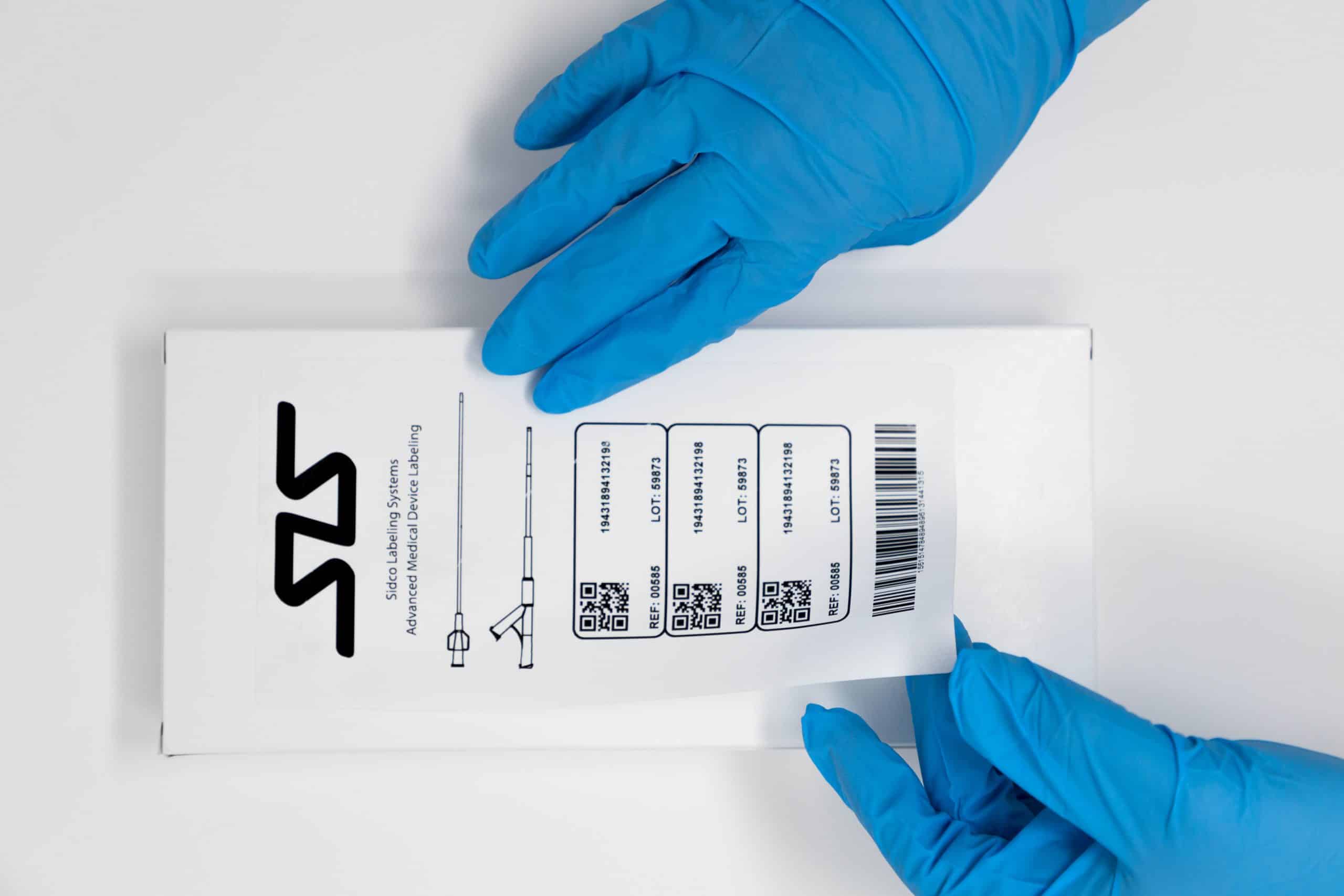 healthcare medical device label being applied to box