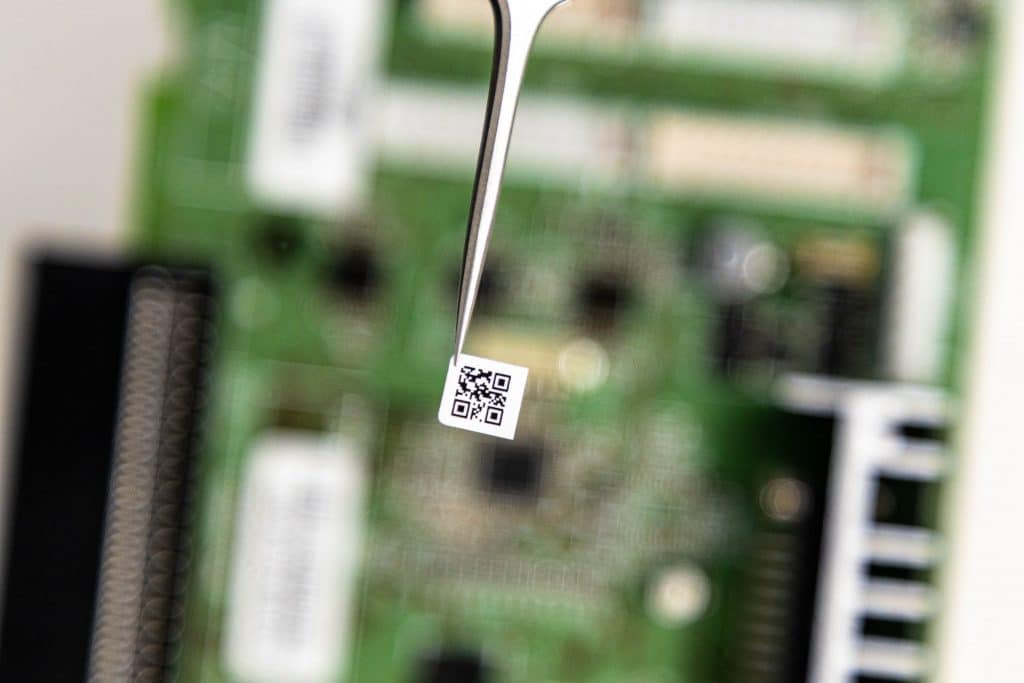 barcode label being applied on circuit board